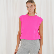 Load image into Gallery viewer, Person wearing a bright pink sleeveless top and gray pants against a white background
