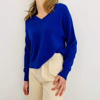 Lady in Jumper with cream trouser on white background 