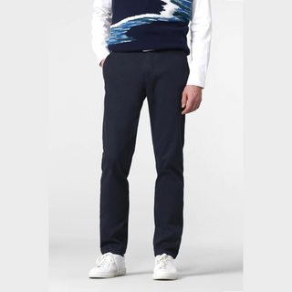 Person wearing navy pants and a patterned sweater on a white background