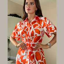 Load image into Gallery viewer, female model wearing girl in mind verity shirt dress in orange color  with hands on waist looking away from camera
