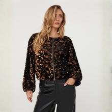 Load image into Gallery viewer, The model is dressed in the EsQualo Velour Jacket, featuring a plush velour fabric adorned with shimmering sequins. Its sparkling details bring a touch of luxury to her look, while the stylish silhouette creates a polished and elegant finish.
