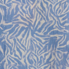Load image into Gallery viewer, A close-up of a fabric or material swatch with an abstract wavy pattern in light blue and off-white, with small scattered reflective glitter flecks.

