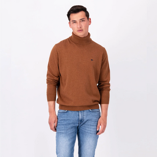 Model wearing the Walnut Brown coloured Fynch Hatton Polo Neck with sleeves pushed up too elbows, wearing blue jeans