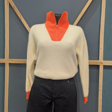 Load image into Gallery viewer, Front of Twns The Label Breckenridge White/Neon Orange, with a wooden and blue background.
