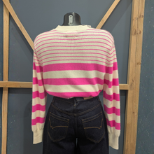 Load image into Gallery viewer, Back of Twns The Label Orleans in White/Neon Pink, with a wooden and blue background.
