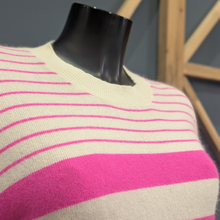 Load image into Gallery viewer, Close up of Twns The Label Orleans in White/Neon Pink, with a wooden and blue background.
