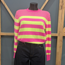 Load image into Gallery viewer, Front of Twns The Label Orleans Neon Pink/Yellow set on a mannequin, with a wooden and blue background.
