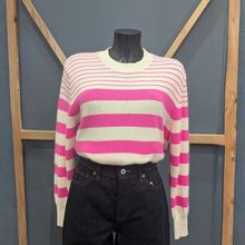 Load image into Gallery viewer, Front of Twns The Label Orleans in White/Neon Pink, with a wooden and blue background.
