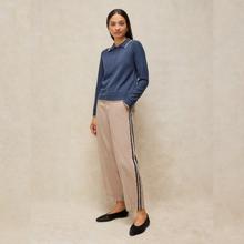 Load image into Gallery viewer, Lady wearing beige trouser with blue top 
