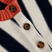 Load image into Gallery viewer, Close-up of a striped knit cardigan or sweater with dark navy and off-white vertical stripes, a coral orange ribbed collar, and three tortoiseshell buttons.

