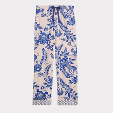 Load image into Gallery viewer, Beige pants with blue floral and animal pattern on a white background
