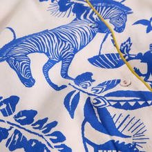 Load image into Gallery viewer, Close-up of a shirt with blue animal prints on a white background
