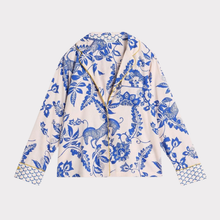 Load image into Gallery viewer, White jacket with blue floral and animal pattern on a white background

