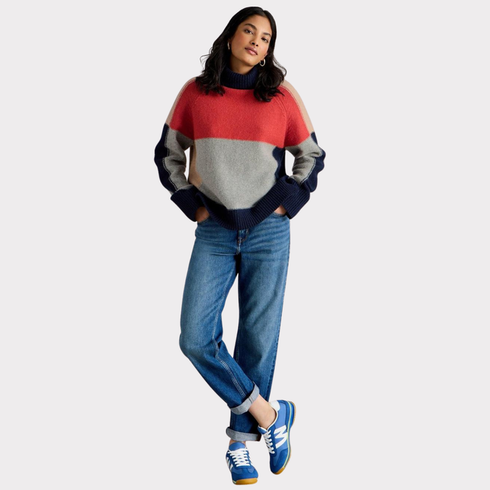 Model wearing the White Stuff Mary Colourblock Jumper, paired with blue jeans.