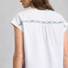 Load image into Gallery viewer, White blouse with green embroidery on a plain background

