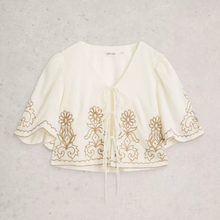 Load image into Gallery viewer, White embroidered top on a light gray background
