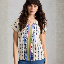 Load image into Gallery viewer, Woman wearing a patterned blouse with a neutral background
