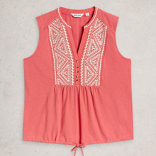 Load image into Gallery viewer, Coral sleeveless top with white embroidery on a light gray background
