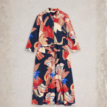 Load image into Gallery viewer, Colorful patterned dress on a light gray background
