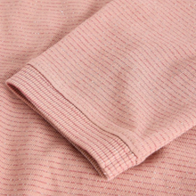 Load image into Gallery viewer, Close-up of a pink textured fabric with a focus on the texture and color.

