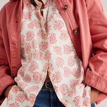 Load image into Gallery viewer, Person wearing a pink jacket with a white patterned shirt underneath.
