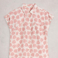 Load image into Gallery viewer, Floral patterned sleeveless shirt on a light gray background
