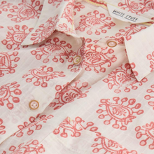 Load image into Gallery viewer, Close-up of a white shirt with red floral patterns and &#39;White Stuff&#39; label.
