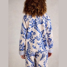 Load image into Gallery viewer, Person wearing a blue and white patterned outfit on a plain background
