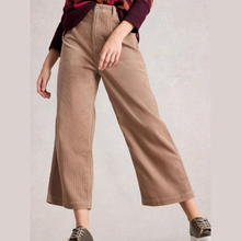 Load image into Gallery viewer, Person wearing brown wide-leg pants on a plain background
