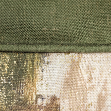 Load image into Gallery viewer, Close-up of green and camouflage-patterned fabric
