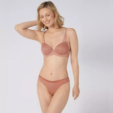 Load image into Gallery viewer, A model wearing the Aura Spotlight Bra and Thong set in Rose. 
